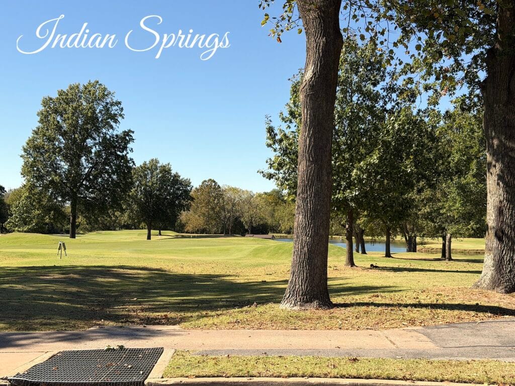 Golf course view with mature trees and water feature at Indian Springs Country Club in Broken Arrow, Oklahoma, near Aspen Crossing Patio Homes.