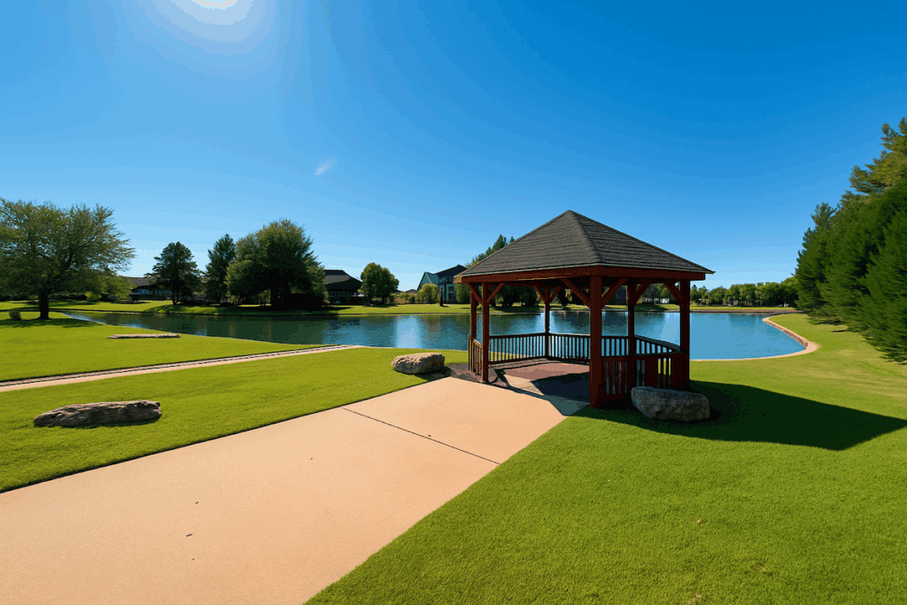 A peaceful gazebo overlooking a pond at The Lakes at Indian Springs in the Indian Springs Broken Arrow community.
