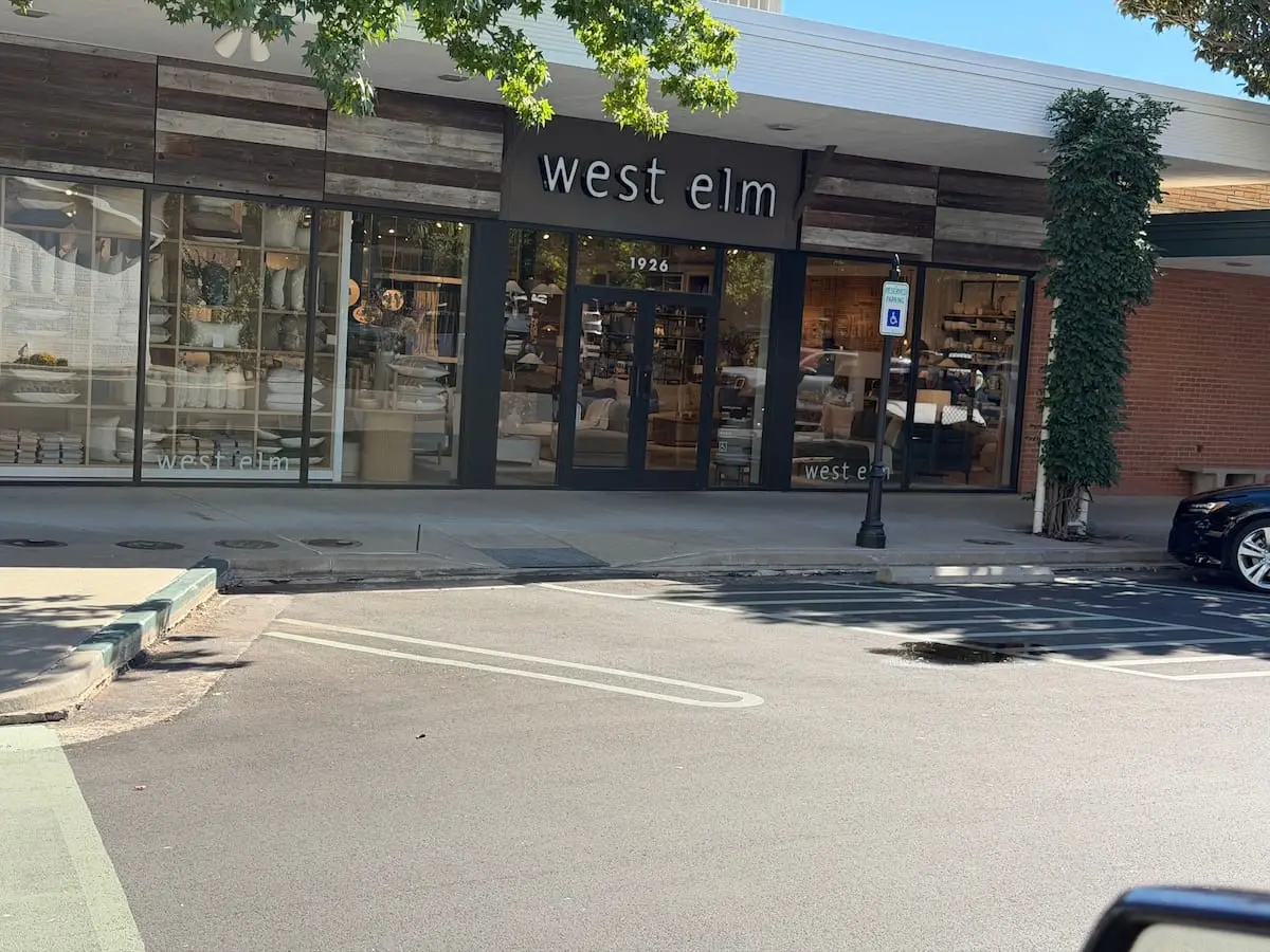 Utica Square shopping district in Midtown Tulsa with landscaped walkways and brick storefronts.
