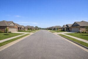 Residential street view of Honey Springs at Battle Creek Broken Arrow OK featuring new single-story brick homes
