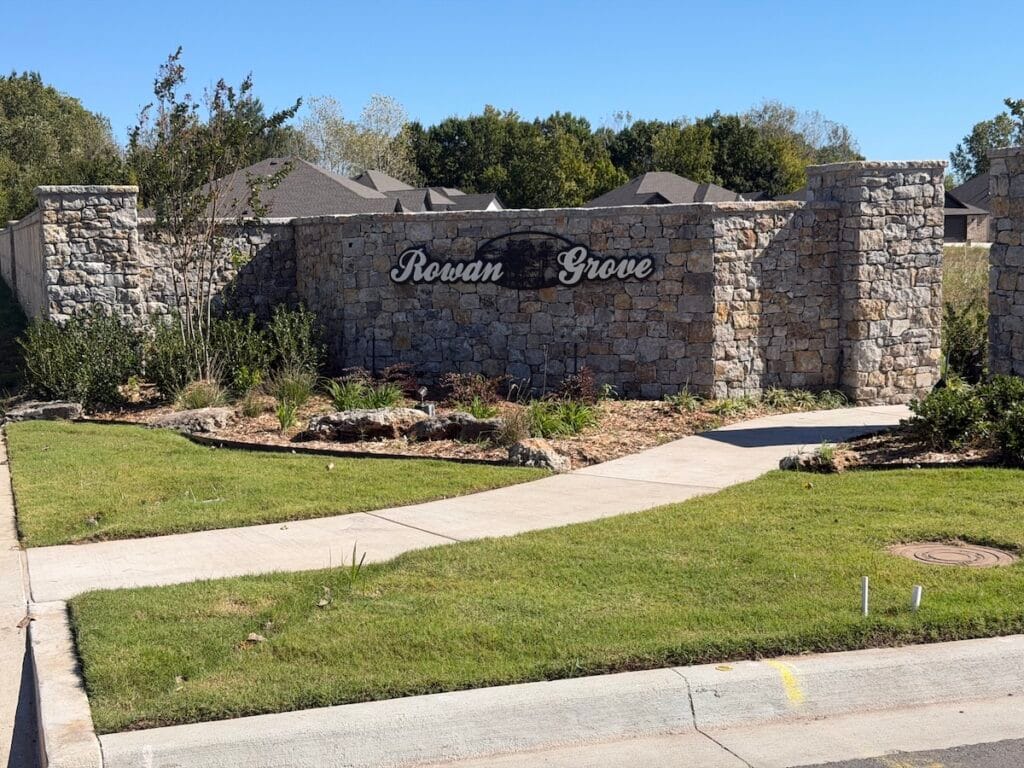 Stone entrance monument sign at Rowan Grove Bixby in Bixby, Oklahoma