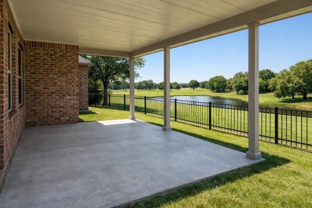 Covered patio and backyard of Shiloh at Battle Creek home backing to Battle Creek Golf Course
