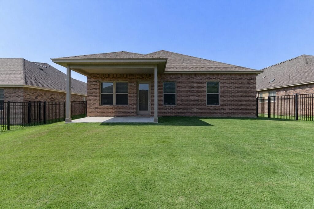 Covered patio and fenced backyard in Magnolia Gardens at Battle Creek